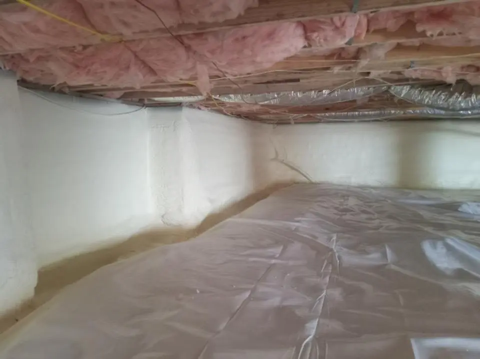 Crawl space encapsulation with closed-cell spray foam for Commercial Roof Restoration in Whitney